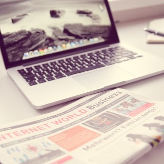 laptop and newspaper