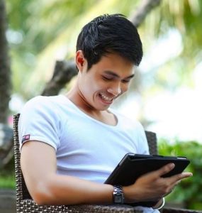 man holding ipad