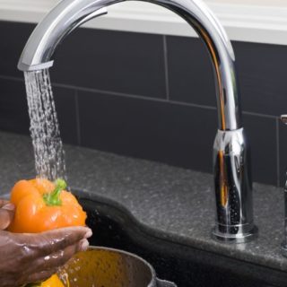 washing vegetables with kitchen faucet